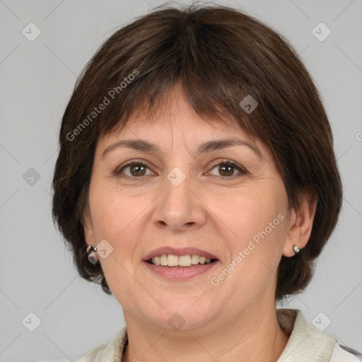 Joyful white adult female with medium  brown hair and brown eyes