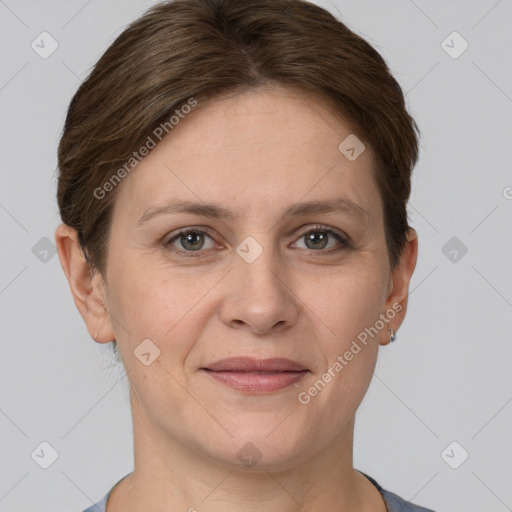 Joyful white adult female with short  brown hair and grey eyes