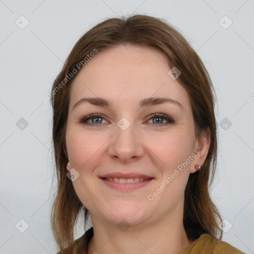 Joyful white young-adult female with medium  brown hair and grey eyes