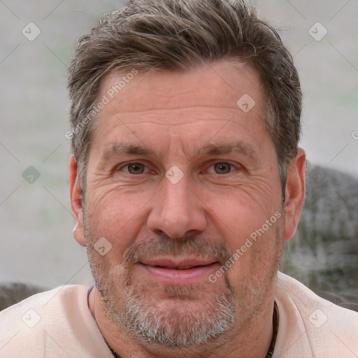 Joyful white middle-aged male with short  brown hair and brown eyes