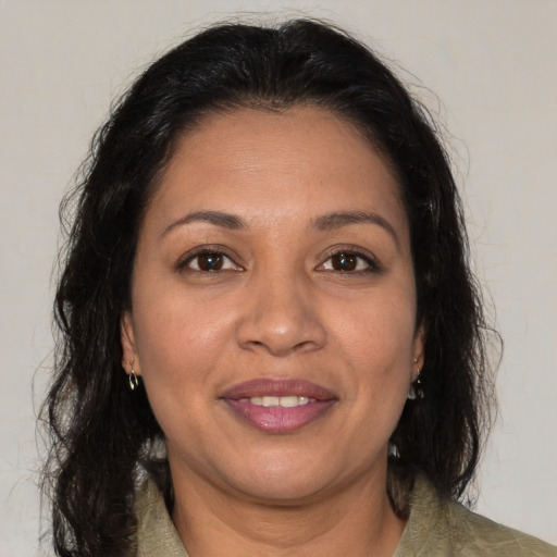 Joyful white adult female with medium  brown hair and brown eyes