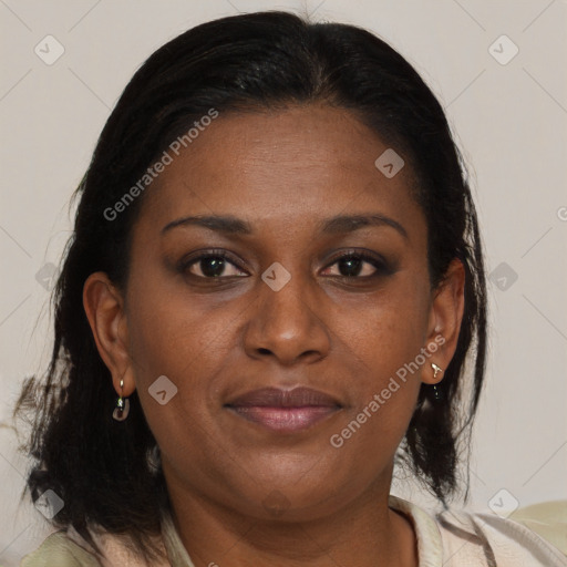 Joyful black adult female with medium  brown hair and brown eyes