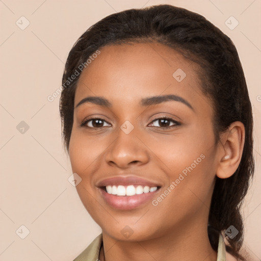 Joyful latino young-adult female with long  brown hair and brown eyes