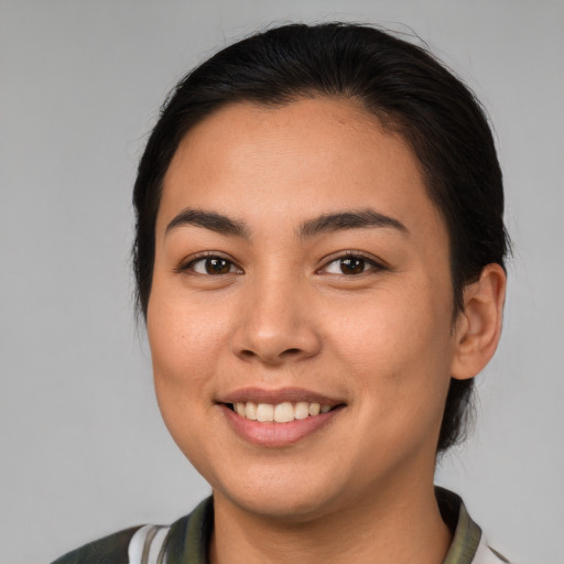 Joyful white young-adult female with medium  brown hair and brown eyes