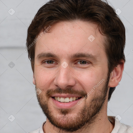 Joyful white young-adult male with short  brown hair and brown eyes