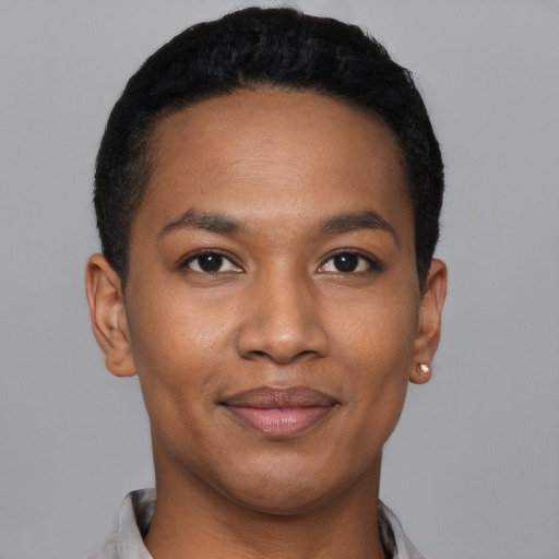 Joyful black young-adult male with short  black hair and brown eyes