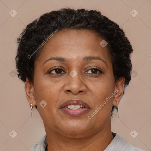 Joyful black adult female with short  brown hair and brown eyes