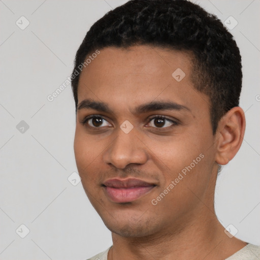 Joyful black young-adult male with short  black hair and brown eyes