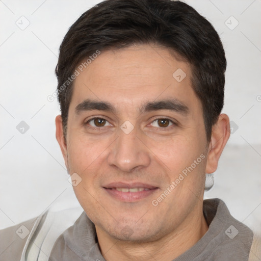 Joyful white adult male with short  brown hair and brown eyes