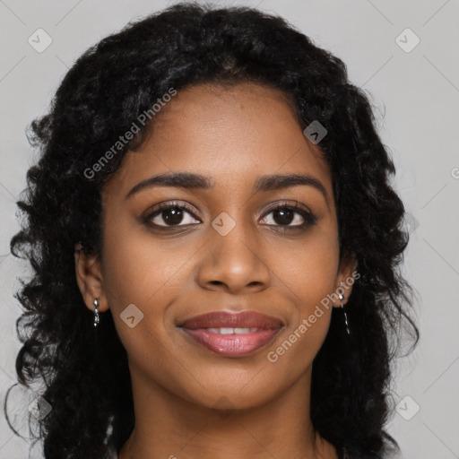 Joyful black young-adult female with long  black hair and brown eyes