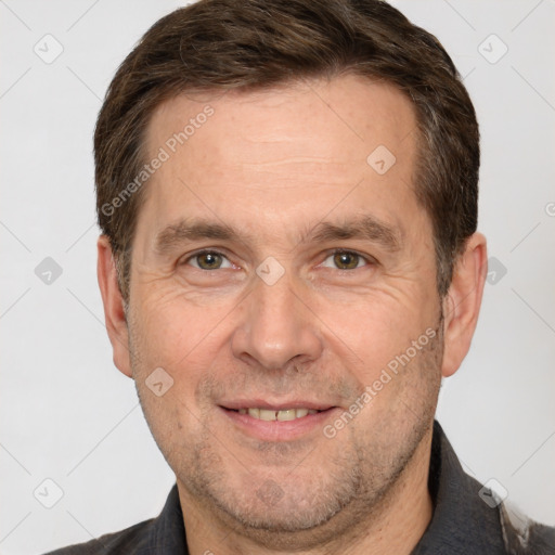 Joyful white adult male with short  brown hair and brown eyes