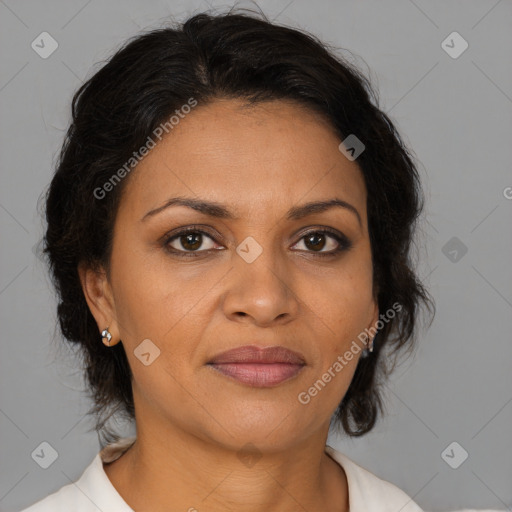 Joyful latino adult female with medium  brown hair and brown eyes