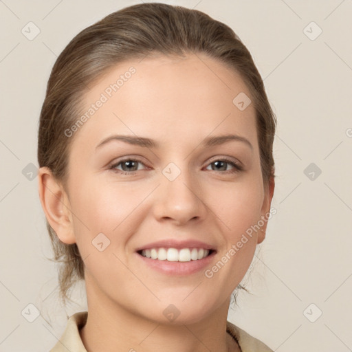 Joyful white young-adult female with medium  brown hair and grey eyes