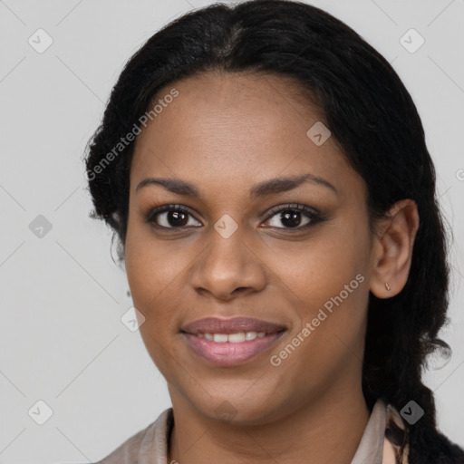 Joyful black young-adult female with long  brown hair and brown eyes