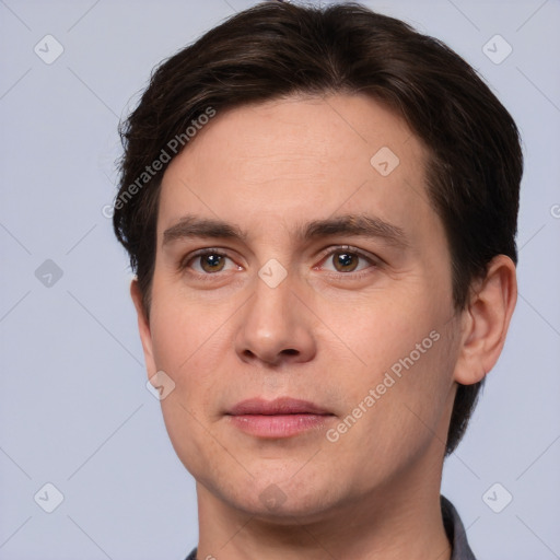 Joyful white young-adult male with short  brown hair and brown eyes