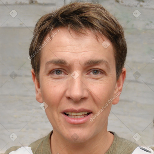 Joyful white adult male with short  brown hair and grey eyes