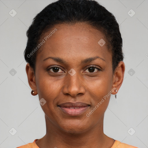 Joyful black young-adult female with short  black hair and brown eyes