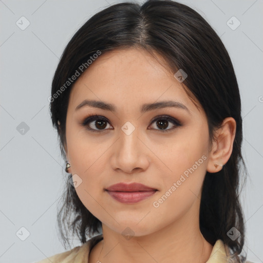 Joyful latino young-adult female with medium  brown hair and brown eyes