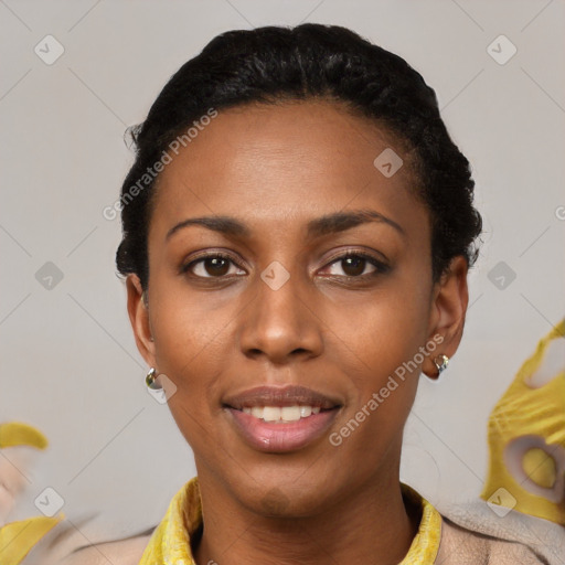 Joyful black young-adult female with short  black hair and brown eyes