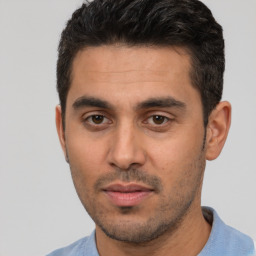 Neutral white young-adult male with short  black hair and brown eyes