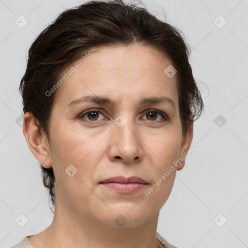 Joyful white adult female with short  brown hair and grey eyes