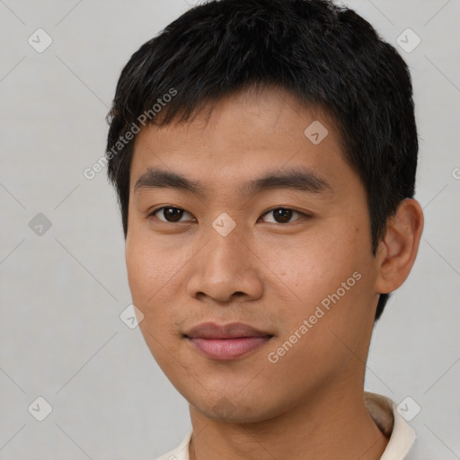 Joyful asian young-adult male with short  black hair and brown eyes