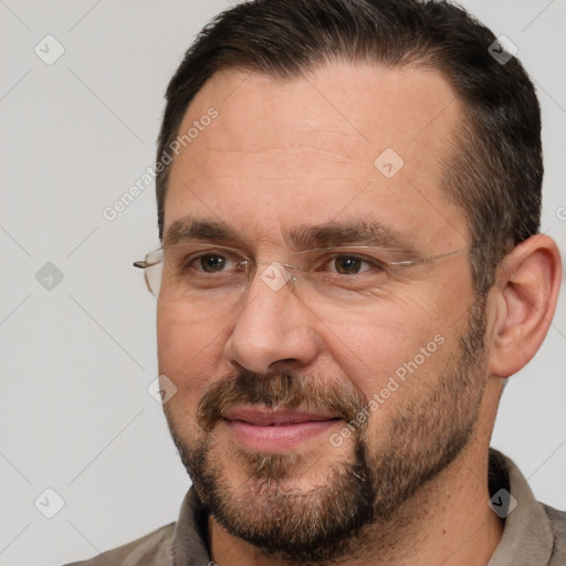 Joyful white adult male with short  brown hair and brown eyes