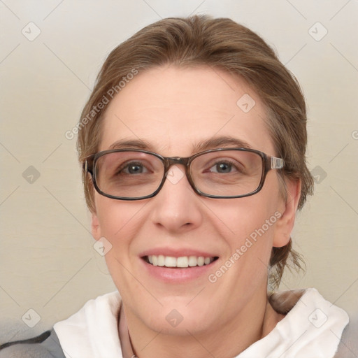 Joyful white adult female with medium  brown hair and blue eyes