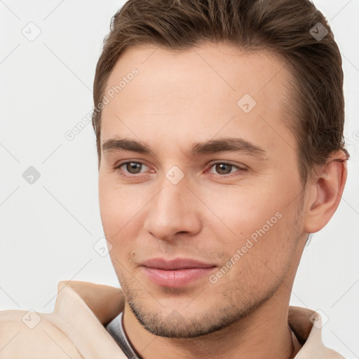 Joyful white young-adult male with short  brown hair and brown eyes