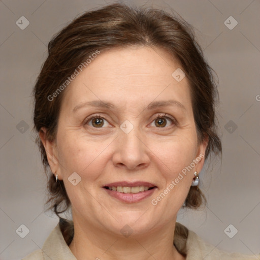 Joyful white adult female with medium  brown hair and brown eyes