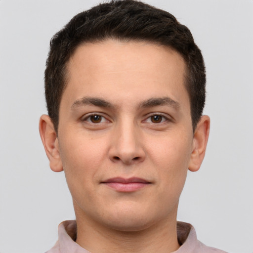 Joyful white young-adult male with short  brown hair and brown eyes