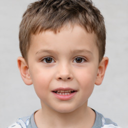 Joyful white child male with short  brown hair and brown eyes