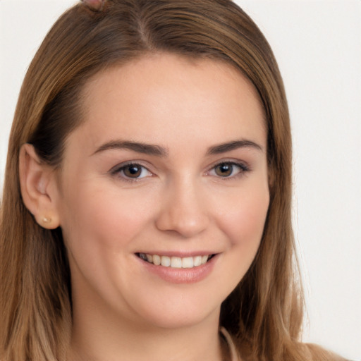 Joyful white young-adult female with long  brown hair and brown eyes