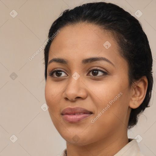 Joyful latino young-adult female with medium  brown hair and brown eyes