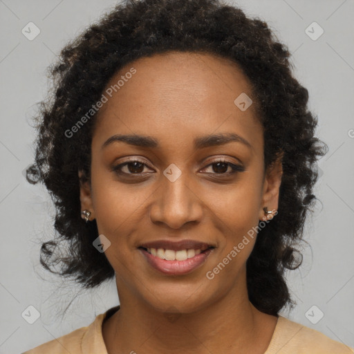 Joyful black young-adult female with long  black hair and brown eyes