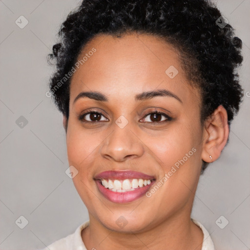 Joyful latino young-adult female with short  black hair and brown eyes