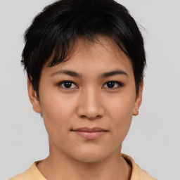 Joyful asian young-adult female with short  brown hair and brown eyes