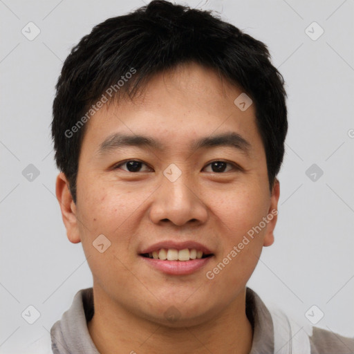 Joyful asian young-adult male with short  brown hair and brown eyes