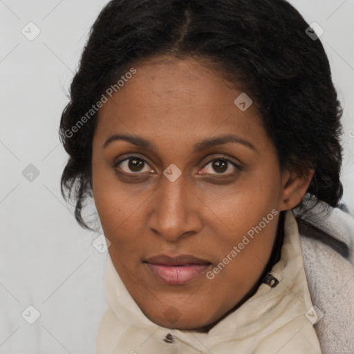 Joyful black young-adult female with long  brown hair and brown eyes