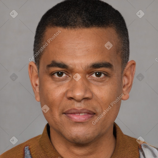 Joyful black young-adult male with short  black hair and brown eyes