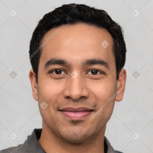 Joyful latino young-adult male with short  black hair and brown eyes