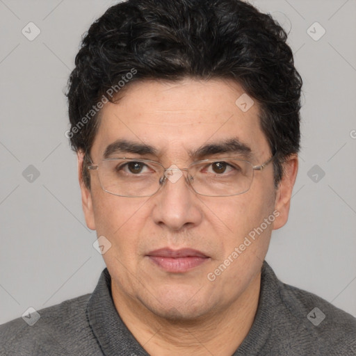 Joyful white adult male with short  black hair and brown eyes