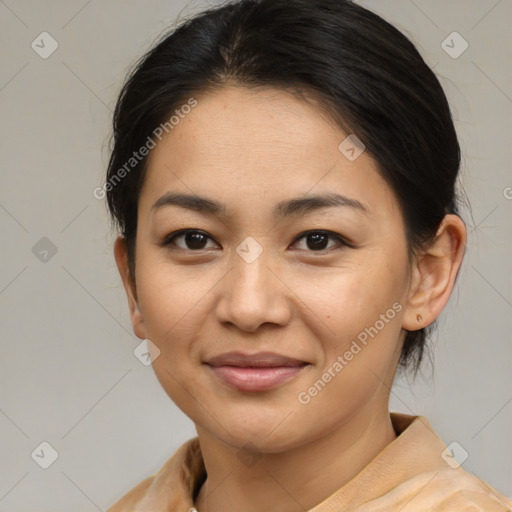 Joyful asian young-adult female with medium  brown hair and brown eyes