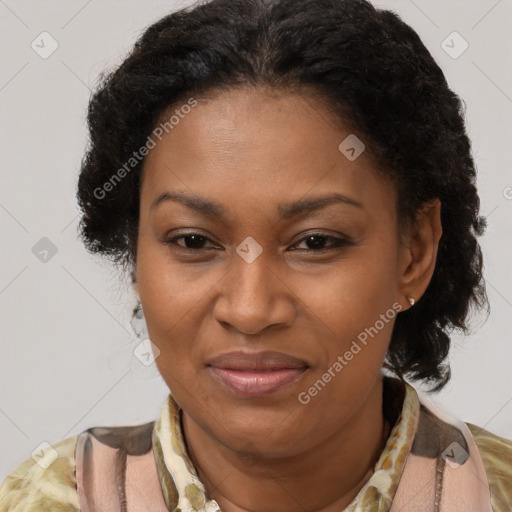 Joyful black adult female with medium  brown hair and brown eyes