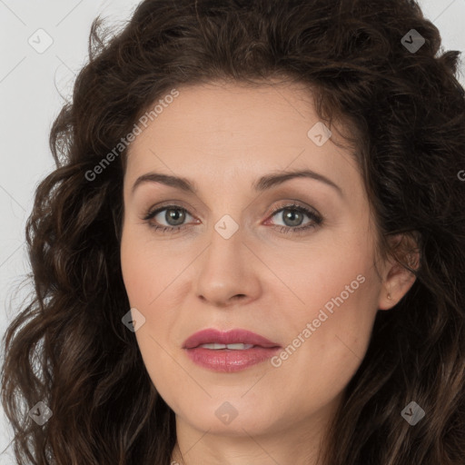 Joyful white adult female with long  brown hair and brown eyes