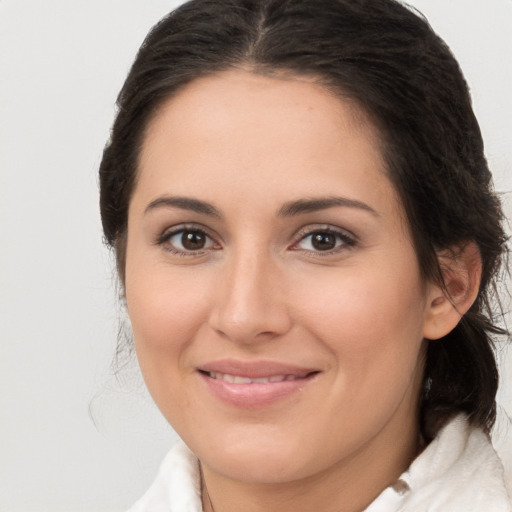 Joyful white young-adult female with medium  brown hair and brown eyes