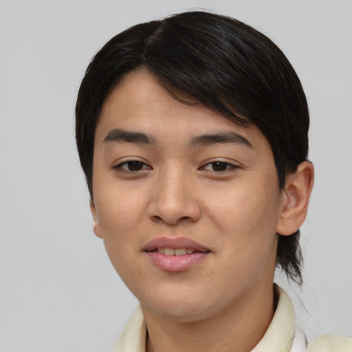 Joyful asian young-adult female with short  brown hair and brown eyes
