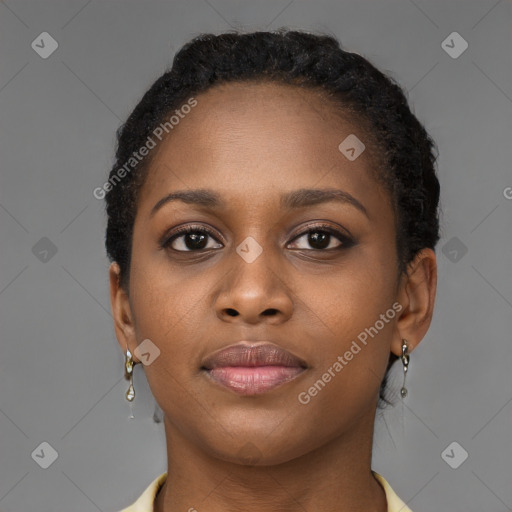 Joyful black young-adult female with long  brown hair and brown eyes