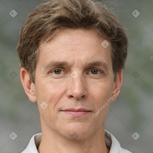 Joyful white adult male with short  brown hair and grey eyes