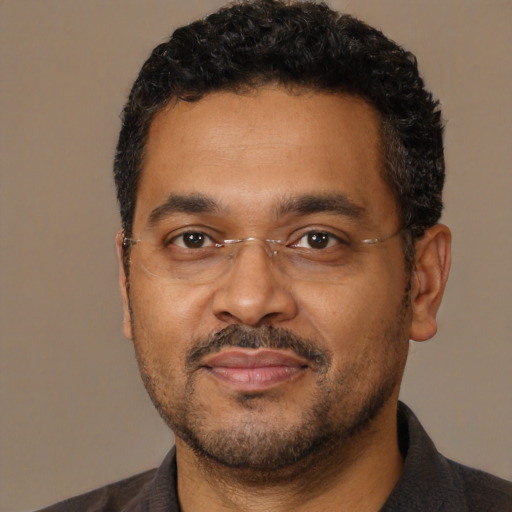 Neutral black adult male with short  black hair and brown eyes